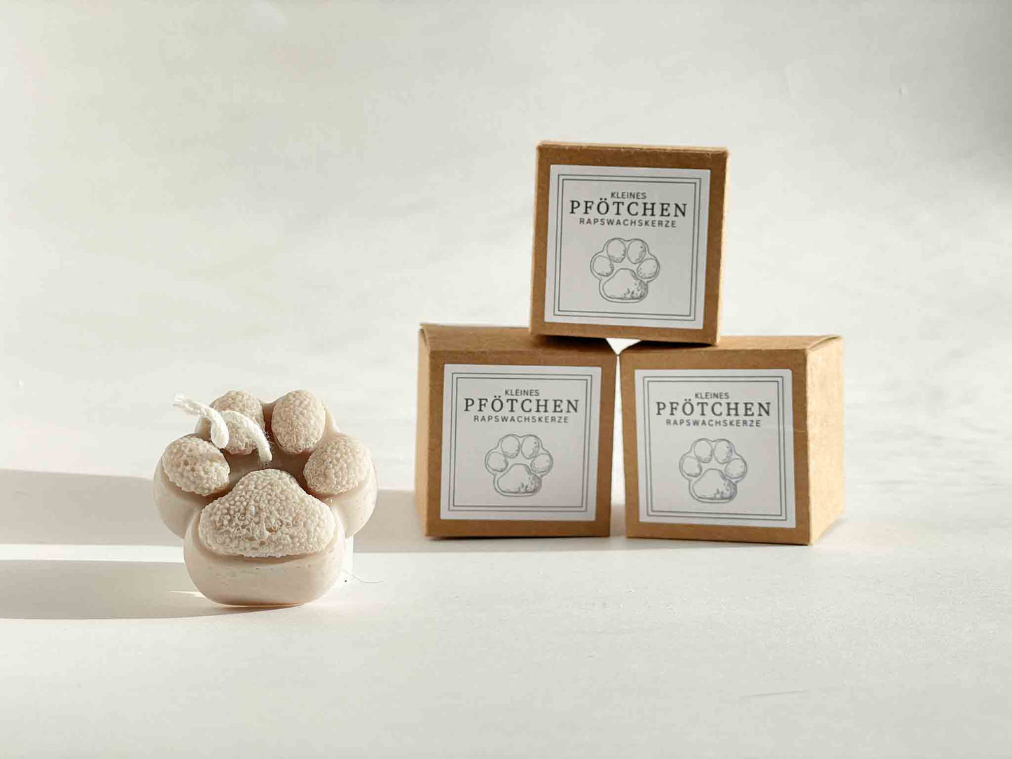 Pfötchenkerze in Geschenkverpackung